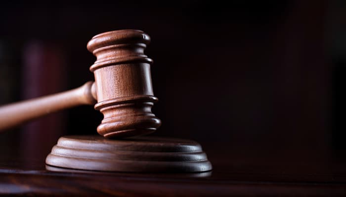 Judges gavel on wooden desk.