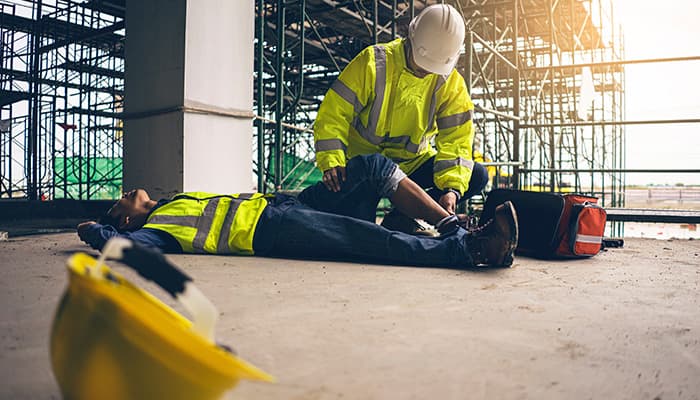 First aid support accident in site work, Builder accident fall scaffolding to the floor, Safety team help employee accident.